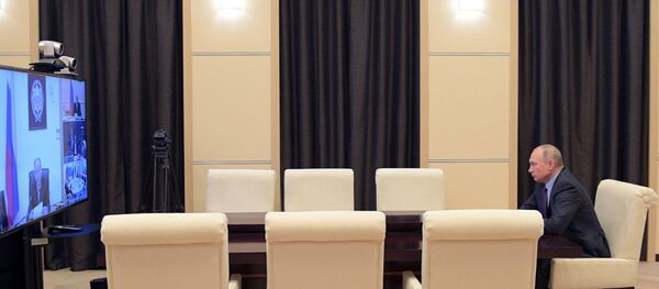 Президент РФ Владимир Путин проводит оперативное совещание с постоянными членами Совета безопасности РФ в режиме видеоконференции. - 俄罗斯卫星通讯社