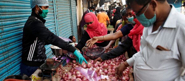 Продавец лука в Индии Продавец лука в Индии - 俄羅斯衛星通訊社