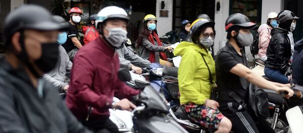 Люди на мопедах в Ханое, Вьетнам Люди на мопедах в Ханое, Вьетнам - 俄罗斯卫星通讯社