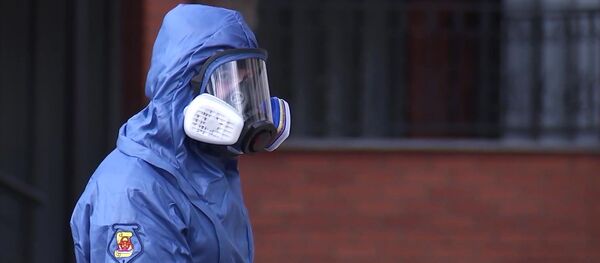 Специалист биохимзащиты, участвующий в дезинфекционной обработке сборного пункта города Москвы. Специалист биохимзащиты, участвующий в дезинфекционной обработке сборного пункта города Москвы. - 俄罗斯卫星通讯社