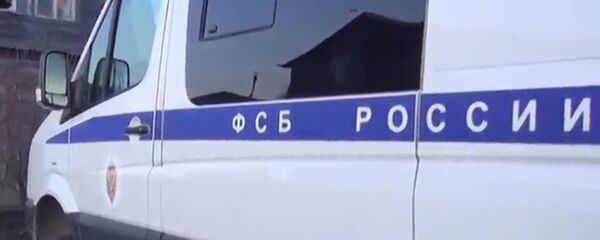 Машина ФСБ у частного дома  - 俄罗斯卫星通讯社