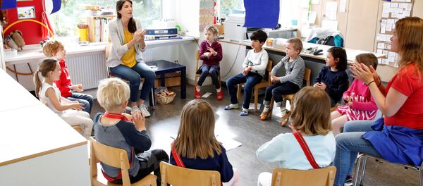 Дети в детском саду после облегчения карантинных мер в Швейцарии Дети в детском саду после облегчения карантинных мер в Швейцарии - 俄罗斯卫星通讯社