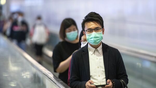 Пассажиры метро в медицинских масках в центральном районе Гонконга - 俄羅斯衛星通訊社