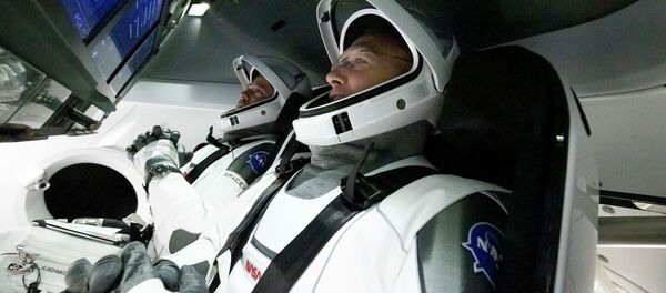 Астронавты Дуглас Херли и Роберт Бенкен в космическом корабле Crew Dragon Астронавты Дуглас Херли и Роберт Бенкен в космическом корабле Crew Dragon - 俄羅斯衛星通訊社