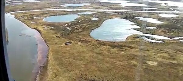 Облет места чрезвычайной ситуации в Норильске. Облет места чрезвычайной ситуации в Норильске. - 俄罗斯卫星通讯社