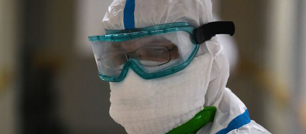 Медицинский работник в одном из отделений госпиталя COVID-19 в Центре мозга и нейротехнологий ФМБА России в Москве. - 俄罗斯卫星通讯社