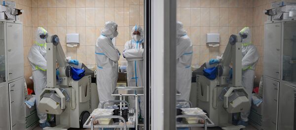 Медицинские работники в отделении госпиталя COVID-19 городской клинической больницы № 15 имени О. М. Филатова в Москве. - 俄羅斯衛星通訊社