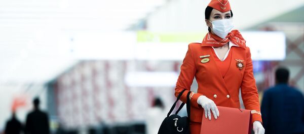 Стюардесса авиакомпании Аэрофлот в аэропорту Шереметьево в Москве - 俄罗斯卫星通讯社