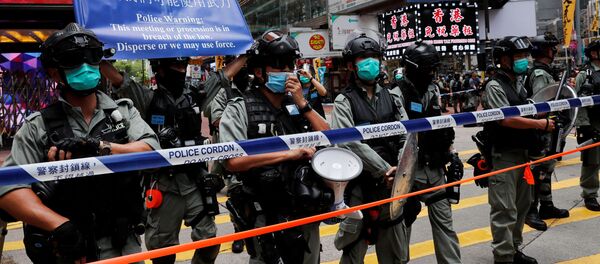 Сотрудники полиции во время акций протестов в Гонконге  - 俄罗斯卫星通讯社