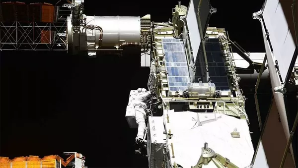 Выход в открытый космос астронавтов NASA Криса Кэссиди и Роберта Бенкена. Архивное фото - 俄羅斯衛星通訊社